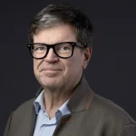 Yann LeCun speaking on artificial intelligence research while wearing his signature bowtie.