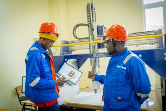 Students working in a university innovation hub supported by UNDP and Africell in West Africa