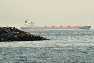 Major shipping lines suspend operations through the Strait of Hormuz following US and Israel strikes on Iran, disrupting oil and container trade.